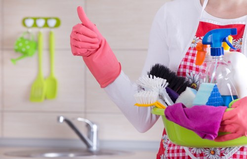 Cleaner removing plaster dust after renovation in Kingston property